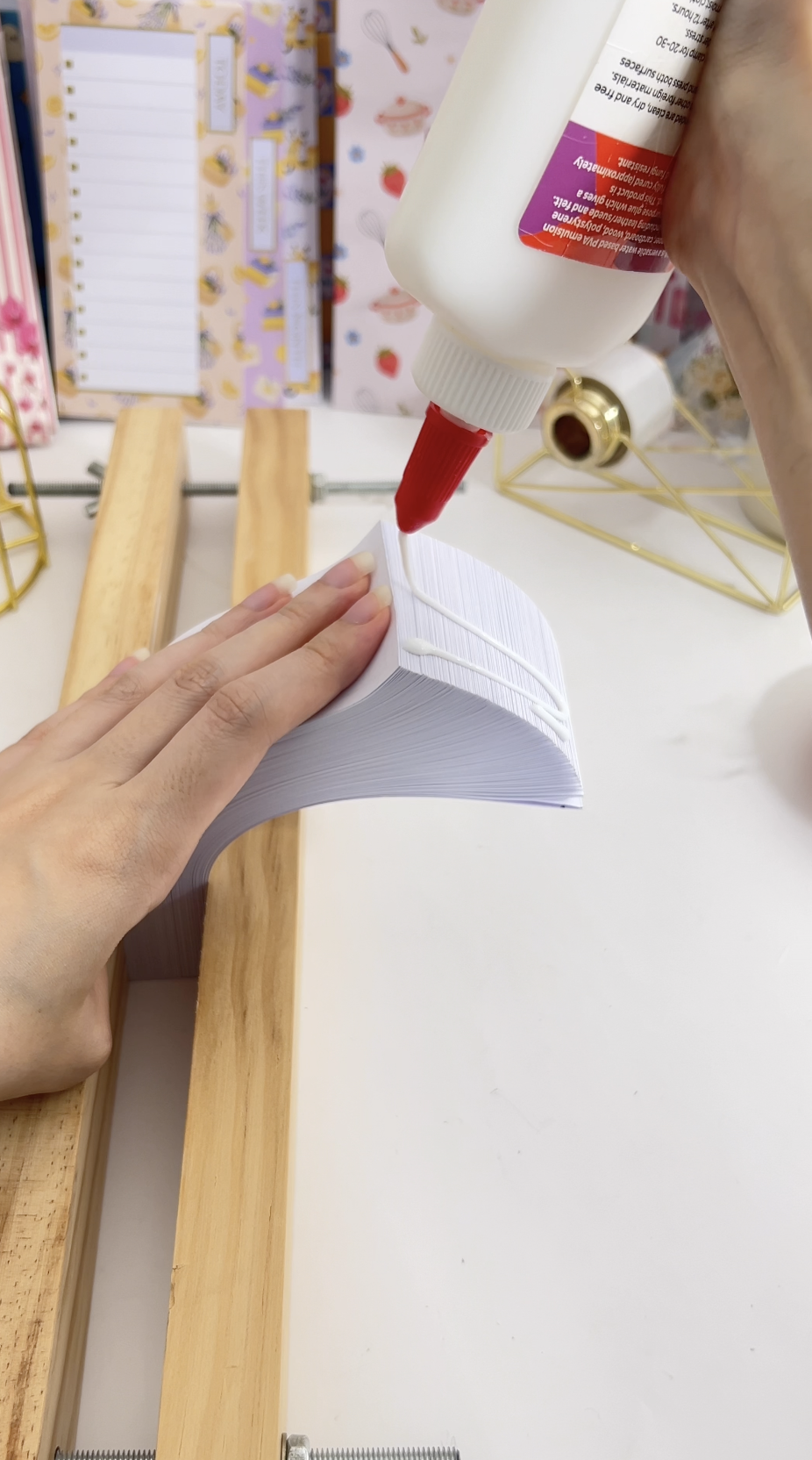 Fanning the stack to the right and applying PVA glue along the folded edges