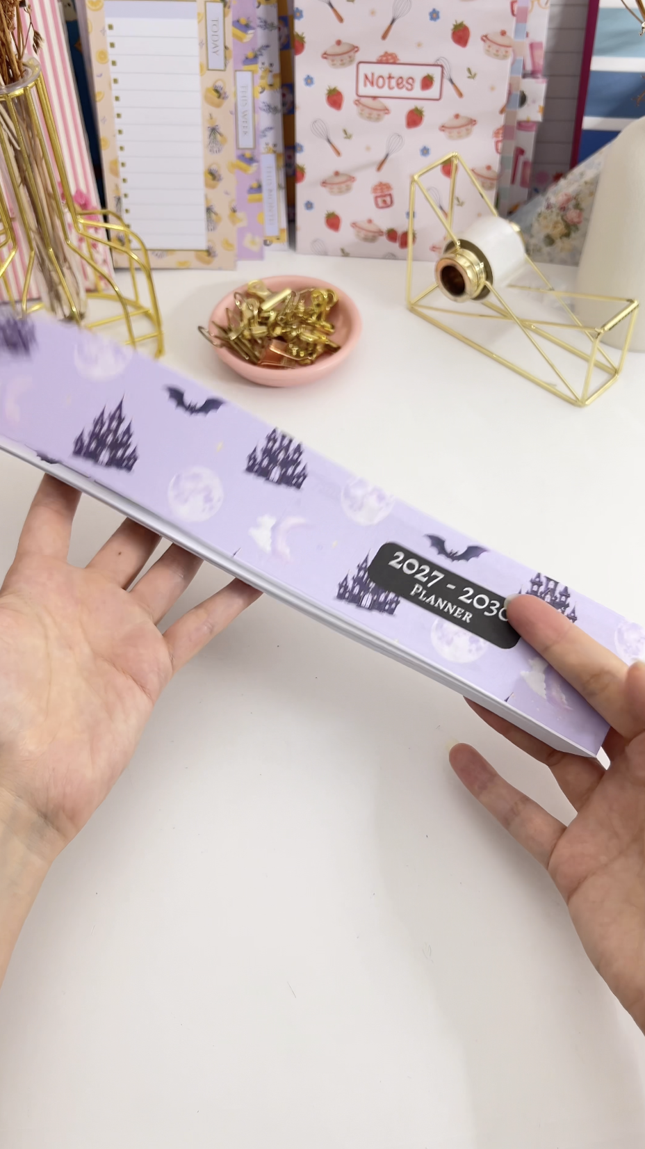 Trimming the printed planner inserts to size with a guillotine cutter