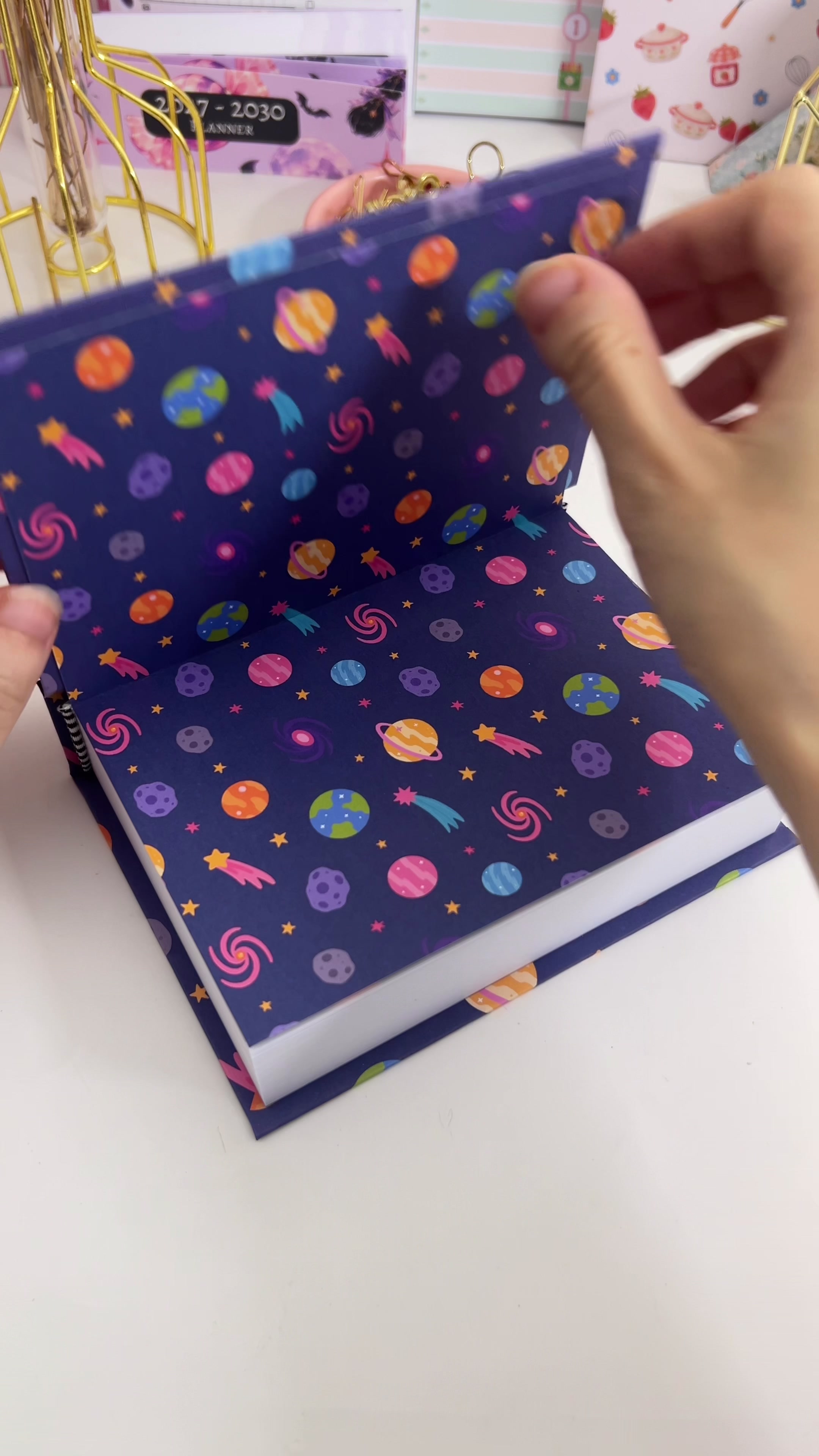 Closing the case onto the taped endpaper and pressing it down