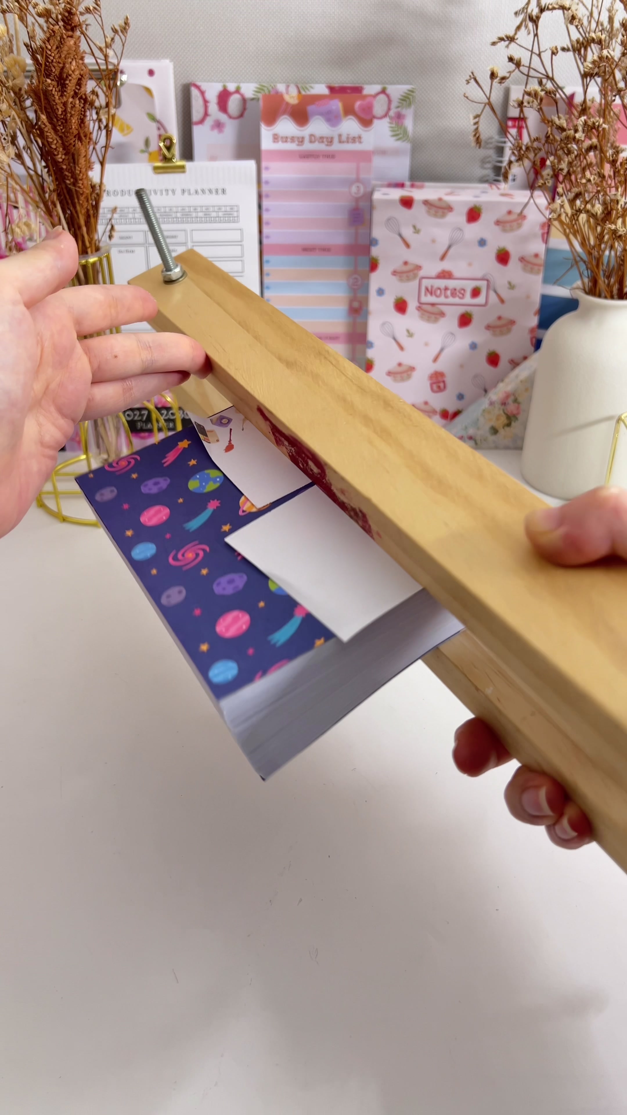 Glued text block left to dry under pressure in the book press
